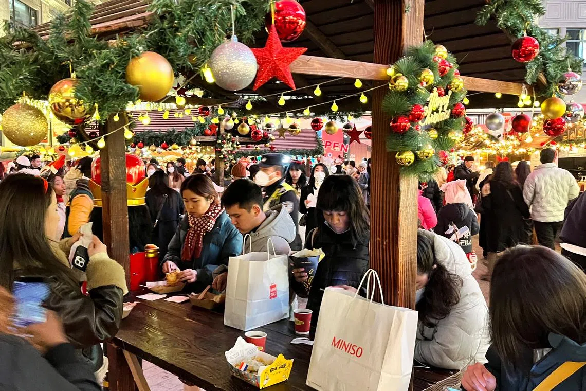 People at a Christmas market in Shanghai on Dec 24, 2022.