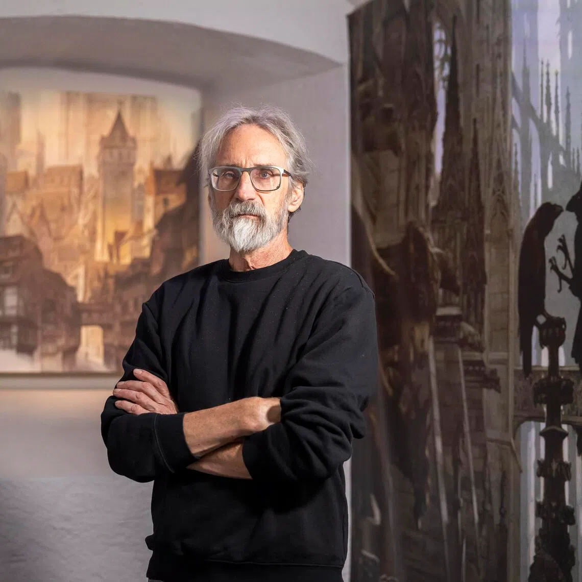 epa12593999 John Howe, Canadian artist and illustrator, poses for a photograph during the inaugural exhibition of 'Journey into the Worlds of John Howe' at the Tour du Fantastique in Neuchatel, Switzerland, 15 December 2025. The Tour du Fantastique is a new cultural space and museum dedicated to imagination and art.  EPA/CYRIL ZINGARO