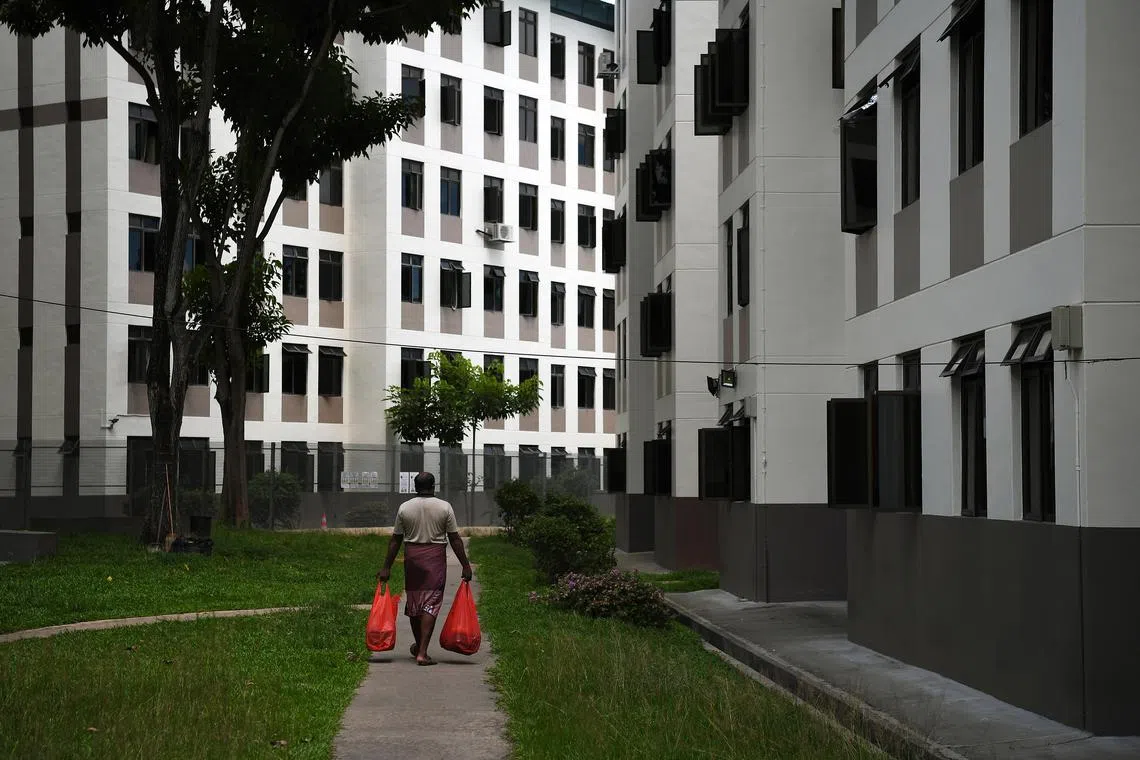 ST20200603_202075835021 Kua Chee Siong/ pixcovid04/ Generic pix of a foreign worker representative returning to his dorm with lunch after collecting food for his co-workers at the Food Collection Centre at the Tampines Dormitory on 3 June 2020.