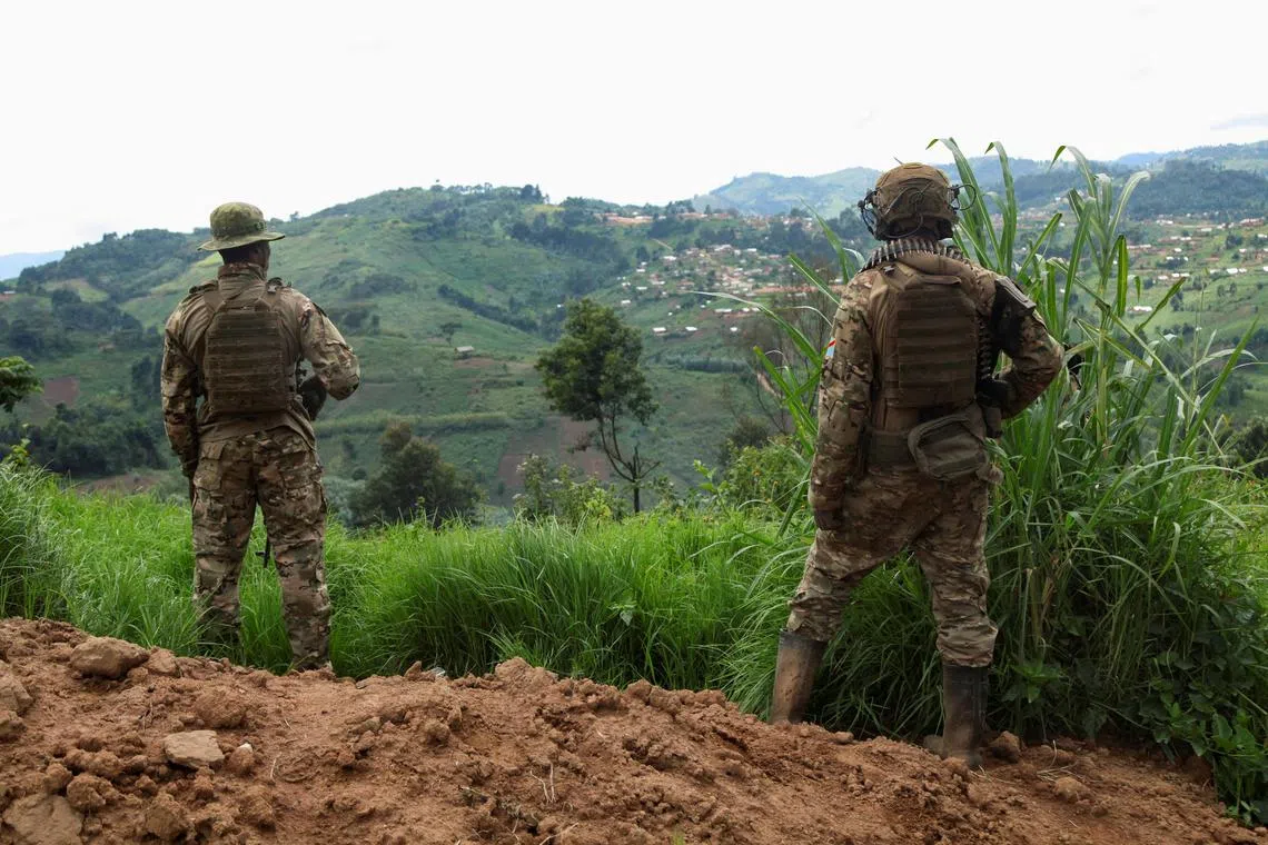 FILE PHOTO: Members of the Armed Forces of the Democratic Republic of the Congo (FARDC) stand guard against the M23 rebel group in Lubero, North Kivu province of the Democratic Republic of Congo October 27, 2024. REUTERS/Djaffar Al Katanty/File Photo