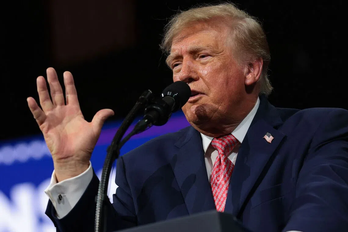 US President Donald Trump speaks during a campaign rally at Heartland Credit Union Arena in Kansas on Oct 19.