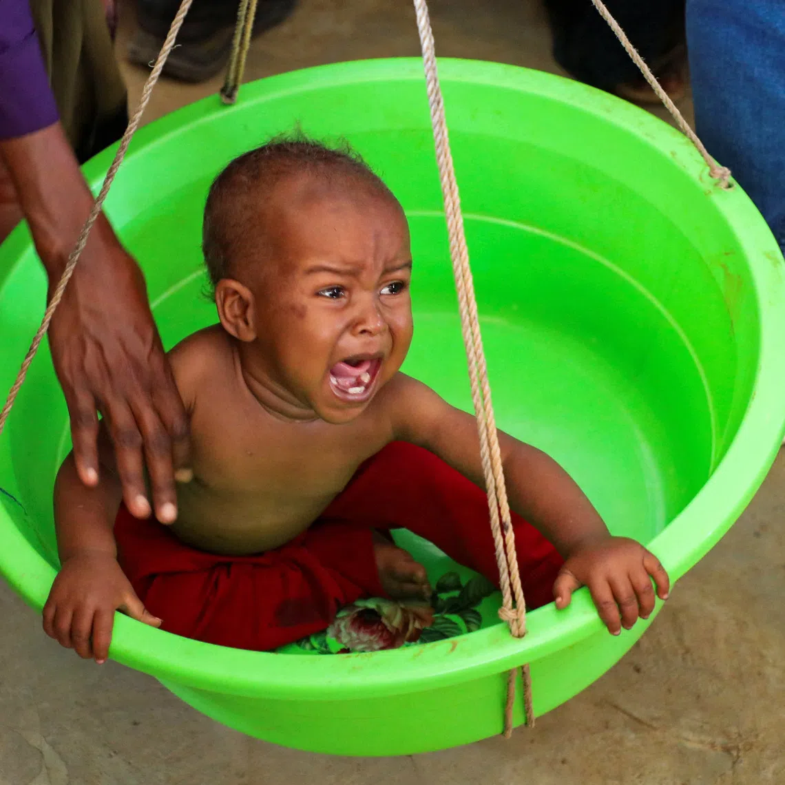 A Somali medical worker screens an internally displaced child for malnutrition at the Medecins Sans Frontieres (MSF) health centre at the Elbet 1 camp as humanitarian funding continues to decline despite rapidly increasing needs according to Medecins Sans Frontieres (MSF), in Baidoa, Somalia  August 10, 2026. REUTERS/Feisal Omar