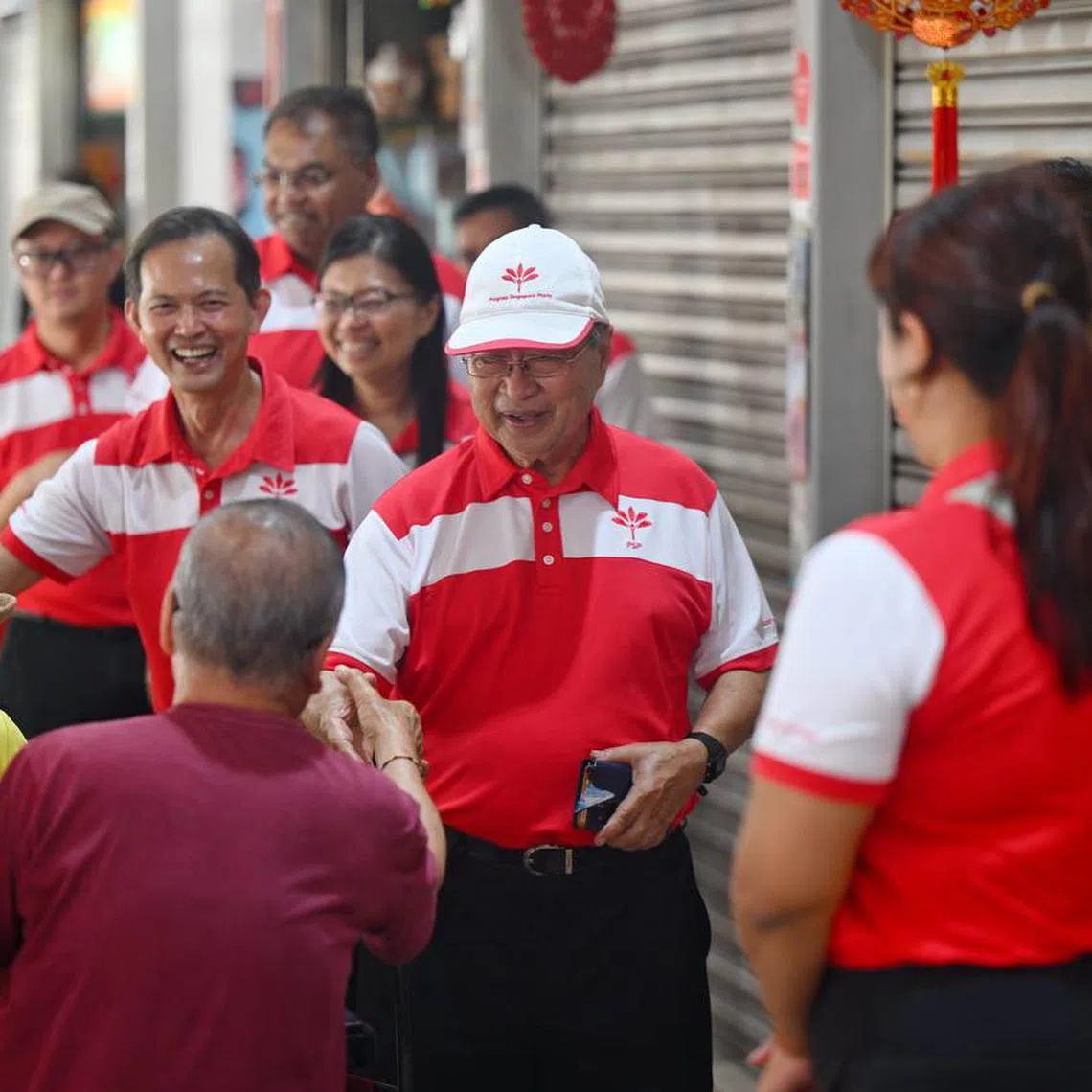 Mr Tan Cheng Bock (centre), Mr Leong Mun Wai (left) and Ms Hazel Poa (background) at Taman Jurong Market on May 1.