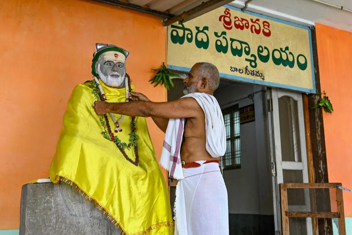 Hindu priest Subhramanya Sharma prays for the victory of Mrs Usha Vance's husband JD Vance at a Sai Baba temple in Vadluru, the ancestral village of Usha's parents.