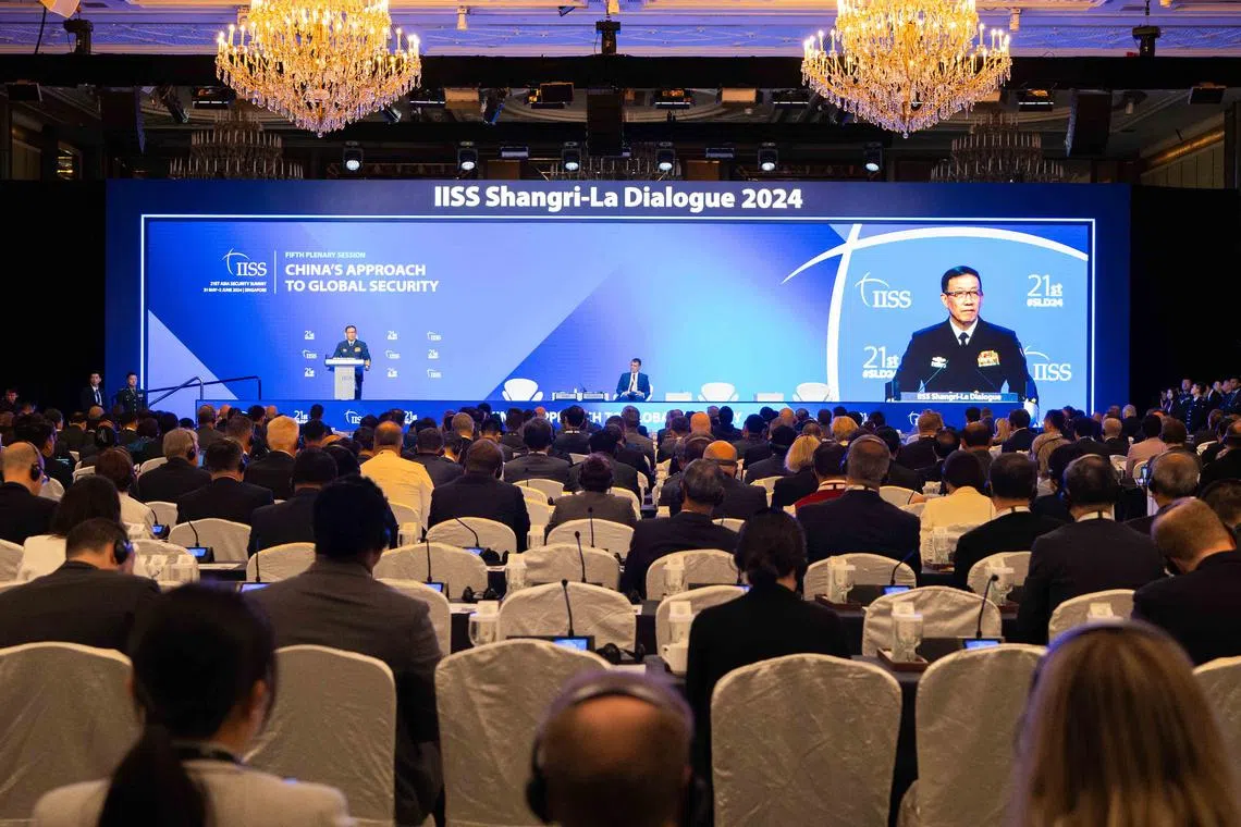 China's Defence Minister Admiral Dong Jun delivering his speech during a plenary session of the Shangri-La Dialogue in Singapore, on June 2.