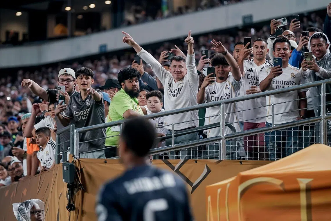 Fans cheer Jude Bellingham of Real Madrid as he is substituted during the Club World Cup match against Salzburg.