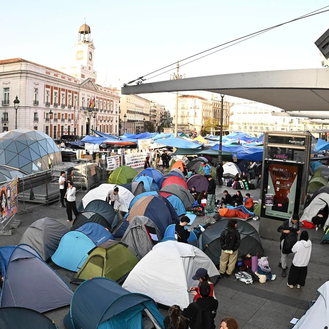 Hundreds of people remain encamped in tents at a housing protest at Puerta del Sol in Madrid on Sept 29.