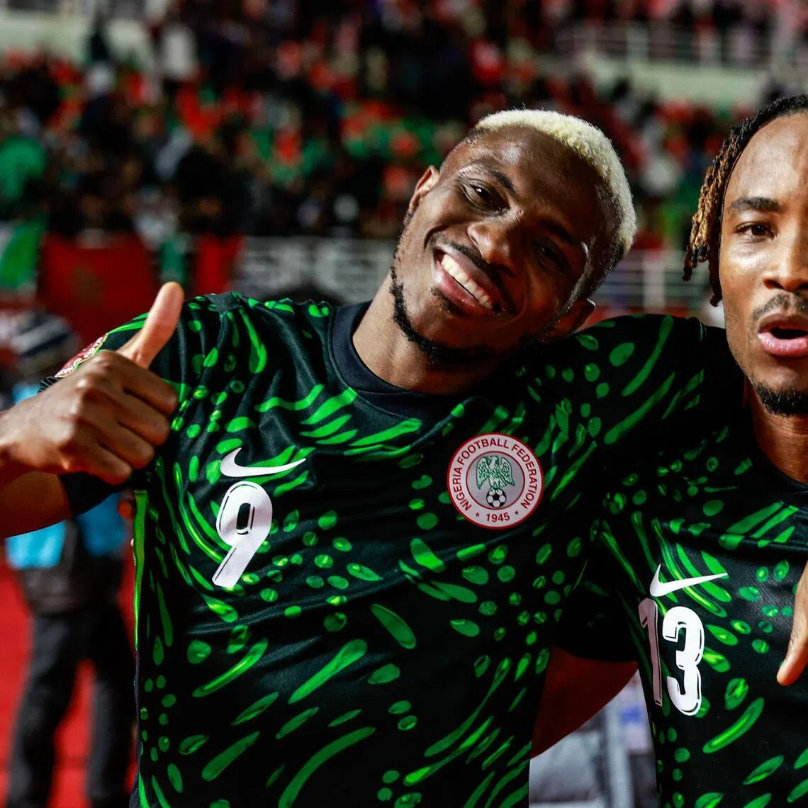 Nigeria's forward Victor Osimhen (left) celebrating with Nigeria's defender Bruno Onyemaechi after the 3-2 Africa Cup of Nations Group C win over Tunisia at Fes Stadium in Fes on Dec 27, 2025.