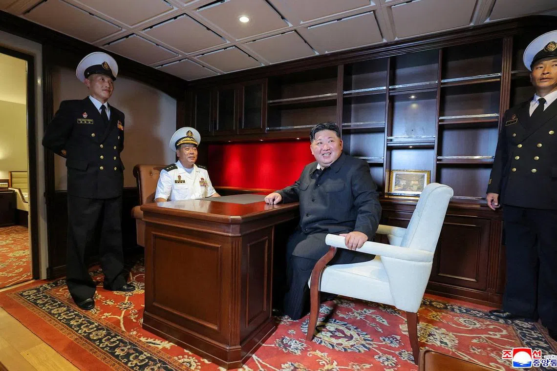 North Korean leader Kim Jong Un visiting a Choe Hyon-class destroyer, in North Korea on Aug 18. 