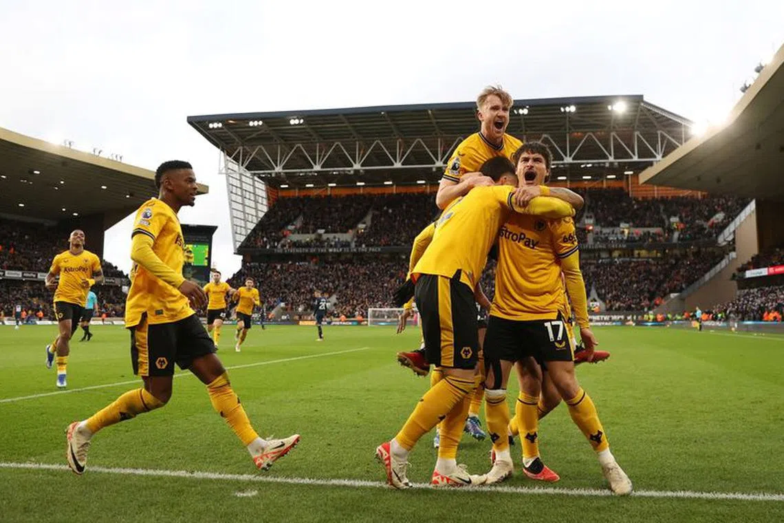 Soccer Football - Premier League - Wolverhampton Wanderers v Chelsea - Molineux Stadium, Wolverhampton, Britain - December 24, 2023 Wolverhampton Wanderers' Matt Doherty celebrates scoring their second goal with Hugo Bueno, Joao Gomes and teammates REUTERS/Carl Recine