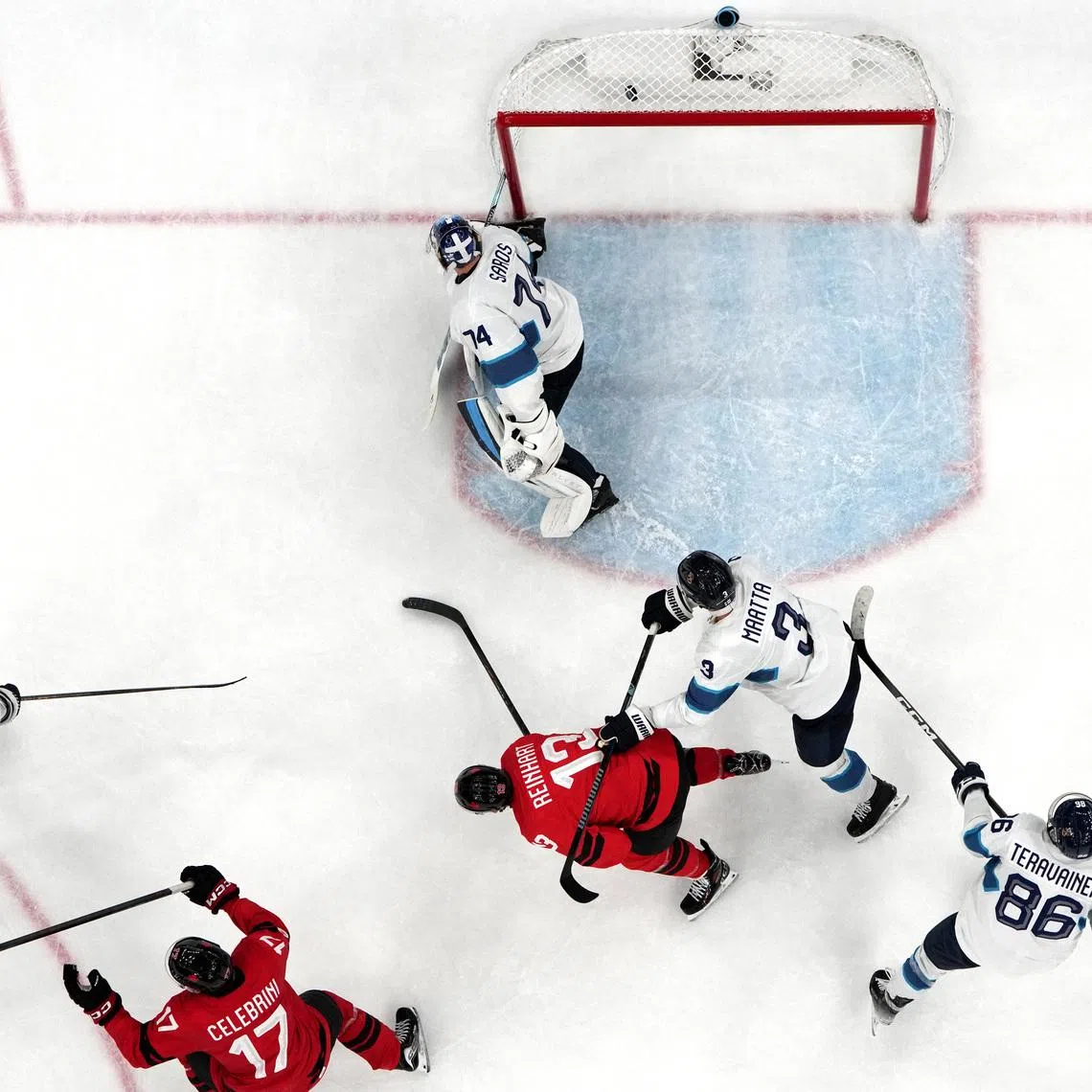Milano Cortina 2026 Olympics - Ice Hockey - Men's Play-offs Semifinals - Canada vs Finland - Milano Santagiulia Ice Hockey Arena, Milan, Italy - February 20, 2026. Nathan MacKinnon of Canada scores their third goal REUTERS/Mike Segar