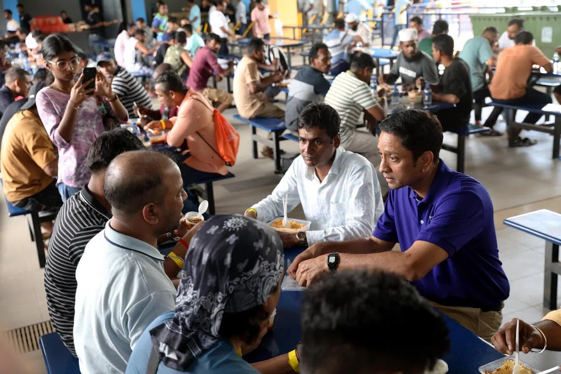 Minister of State for Manpower Dinesh Vasu Dash (right) with migrant workers from KPA Engineering, SK Industries and VVR Plant Engineering at Kranji Recreation Centre on June 28.