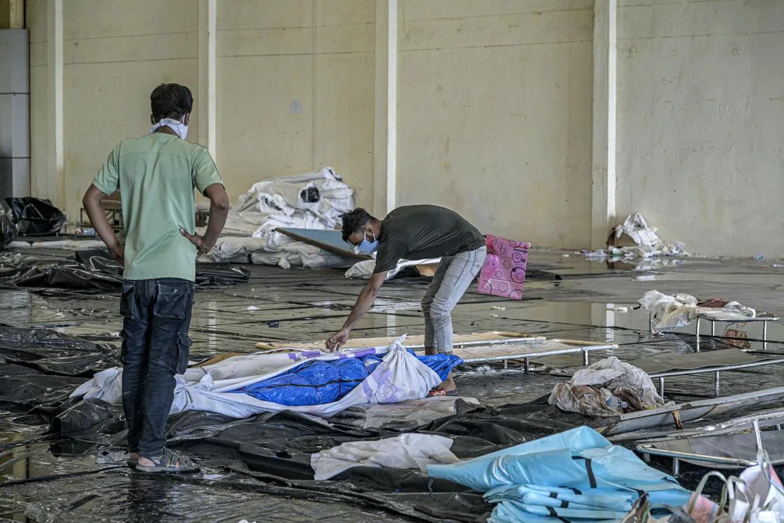 Relatives trying to identify the bodies of victims of the train collision near Balasore, India, on June 4.