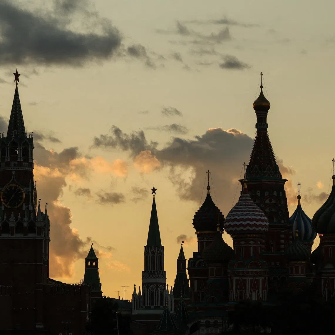 Kremlin's Spasskaya tower and St. Basil's Cathedral, during sunset in Moscow, Russia August 28, 2025.  REUTERS/Evgenia Novozhenina