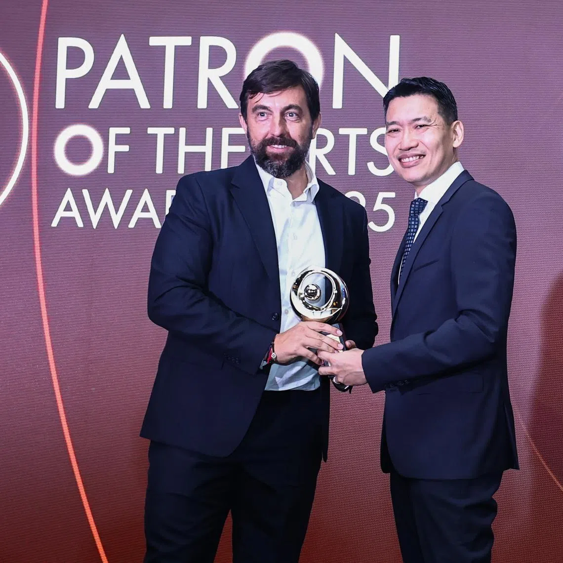 Acting Minister for Culture, Community and Youth David Neo (right) presenting the Distinguished Patron of the Arts Awards to Mr Roger Parellada on Aug 20.