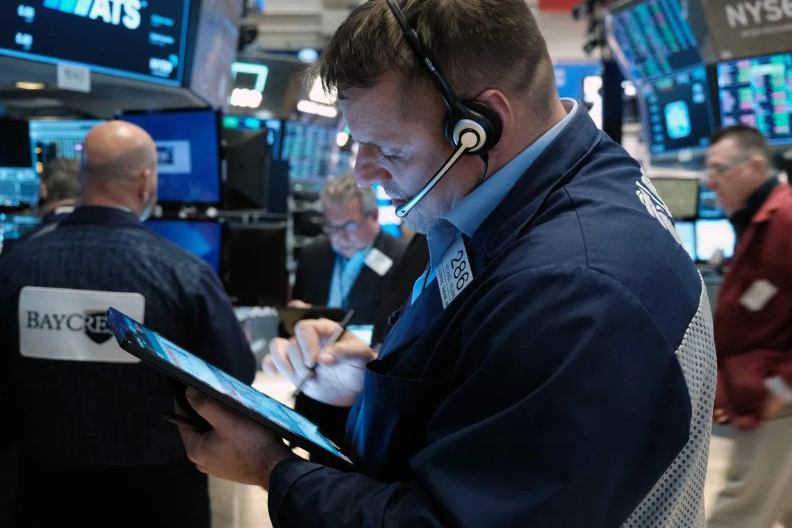 Traders work on the floor of the New York Stock Exchange in New York City.