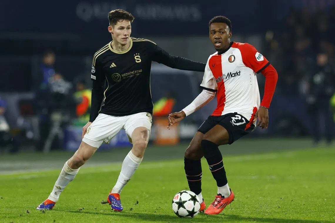 FILE PHOTO: Soccer Football - Champions League - Feyenoord v Sparta Prague - Feyenoord Stadium, Rotterdam, Netherlands - December 11, 2024 Sparta Prague's Martin Vitik in action with Feyenoord's Antoni Milambo REUTERS/Piroschka Van De Wouw/File Photo