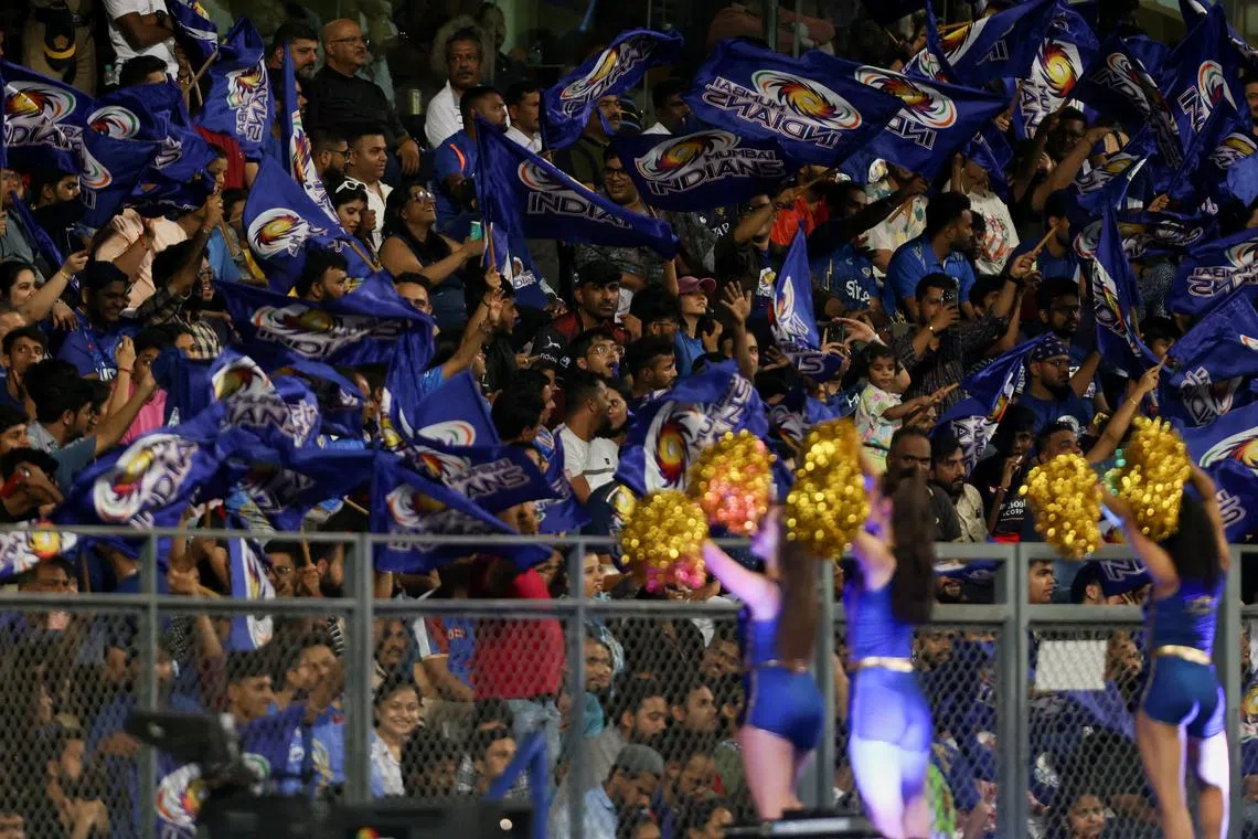 Indian Premier League- Mumbai Indians v Royal Challengers Bangalore- Wankhede Stadium, Mumbai, India - May 9, 2023. Mumbai Indians' fans celebrate during the match. REUTERS/Francis Mascarenhas/File Photo