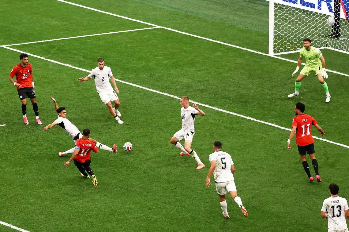 Soccer Football - FIFA World Cup 2026 - Group G - New Zealand v Egypt - BC Place, Vancouver, Canada - June 21, 2026 Egypt's Mohamed Salah scores their second goal past New Zealand's Max Crocombe REUTERS/Lee Smith
