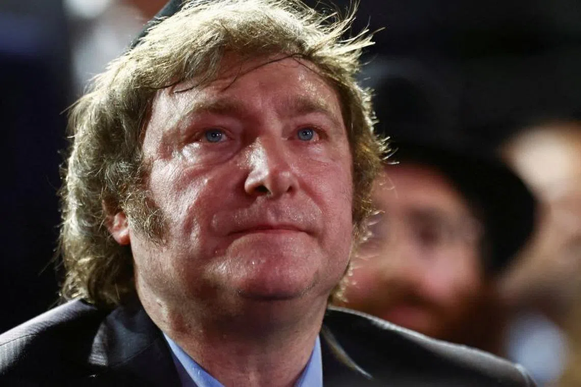 FILE PHOTO: Argentina's President Javier Milei looks on as he attends a Hanukkah celebration in Buenos Aires, Argentina, December 12, 2023. REUTERS/Tomas Cuesta/File Photo