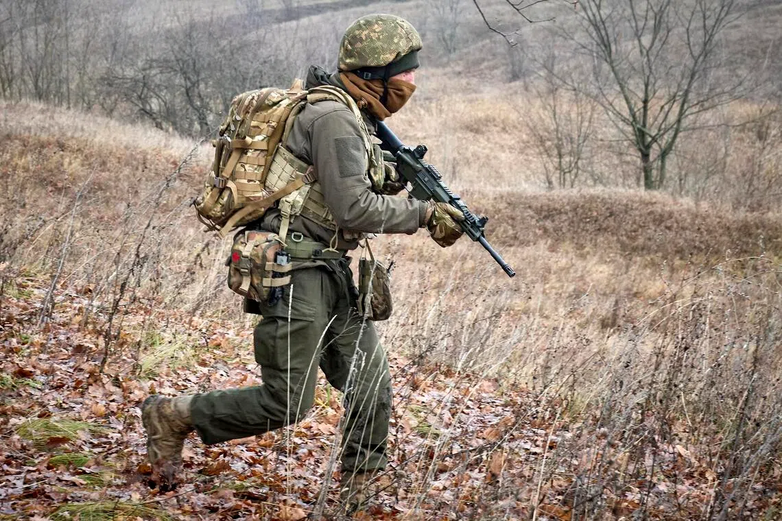 A Ukrainian serviceman taking part in tactical training at an undisclosed location in Ukraine on Dec 3.