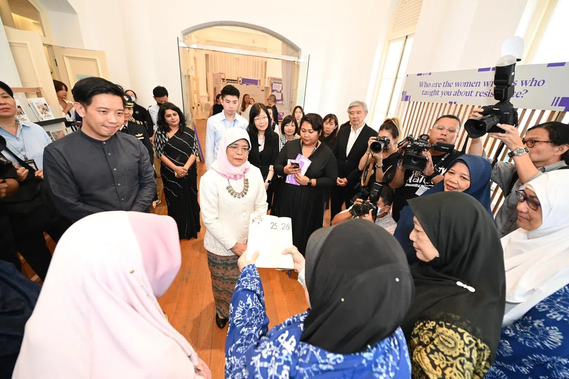 President Halimah Yacob with Malay literary pioneers at the launch of the Singapore Writers Festival.