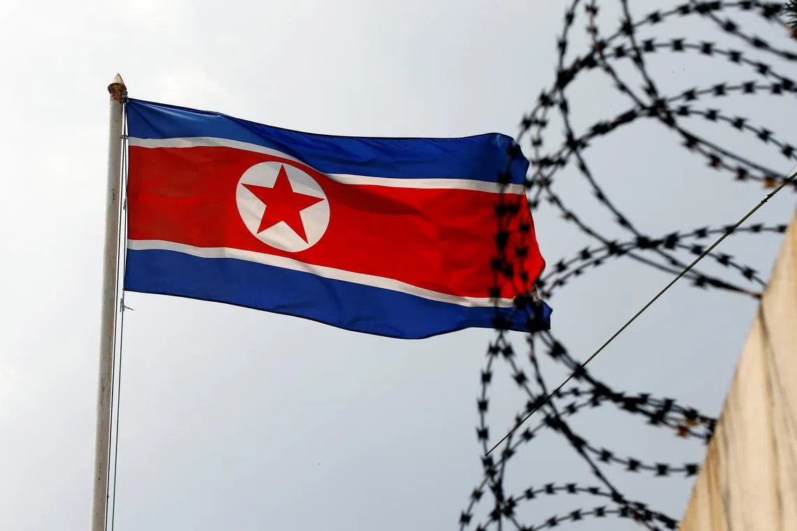 FILE PHOTO: The North Korea flag flutters next to concertina wire at the North Korean embassy in Kuala Lumpur, Malaysia March 9, 2017. REUTERS/Edgar Su/File photo