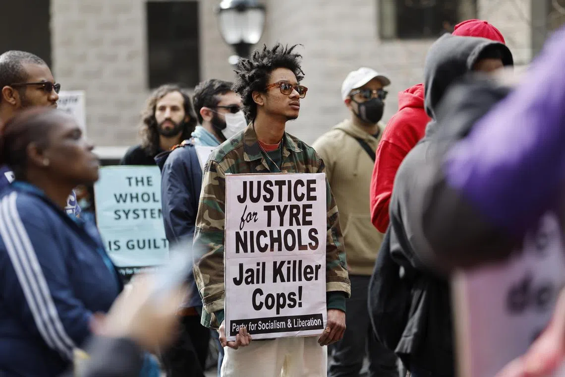Protesters march the day after video footage was released showing the encounter between Tyre Nichols and five Memphis police officers which resulted in his beating and subsequent death.