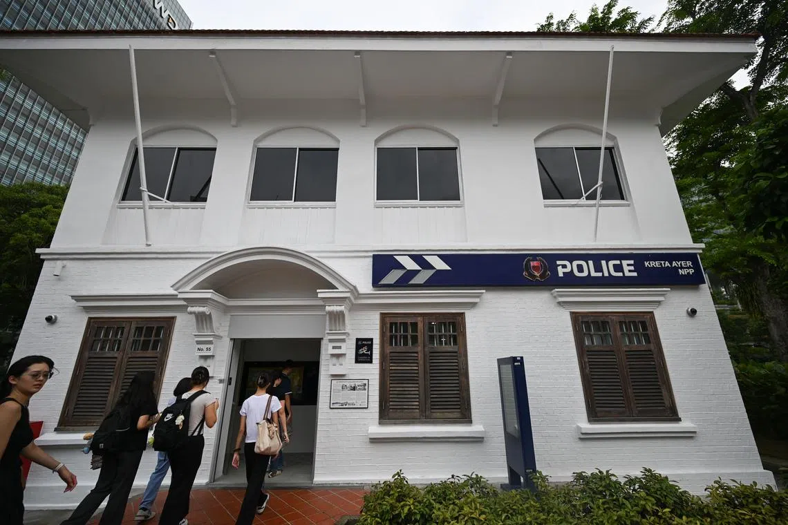 Participants on the heritage trail walking into Kreta Ayer Neighbourhood Police Post on July 2.