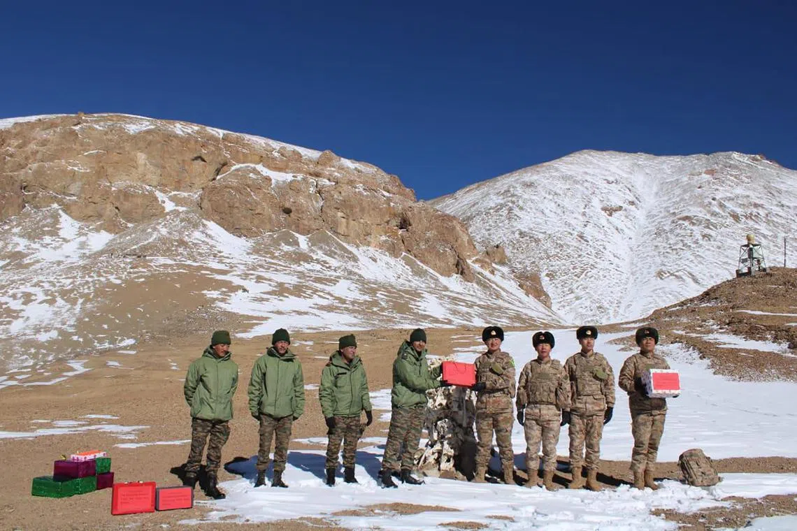 Indian and Chinese army greet each other along the Line of Actual Control (LAC) near Karakoram pass in Ladakh on Oct 31, 2024, on the occasion of Diwali.