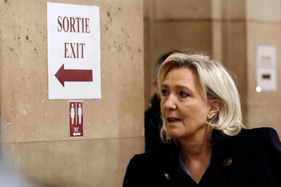French far-right leader Marine Le Pen, member of parliament from the Rassemblement National (National Rally - RN) party, arrives for a hearing in her appeal trial alongside the RN party itself and 10 others defendants found guilty of diverting European Parliament funds, at the Paris courthouse on the Ile de la Cite, in Paris, France, January 20, 2026. REUTERS/Benoit Tessier
