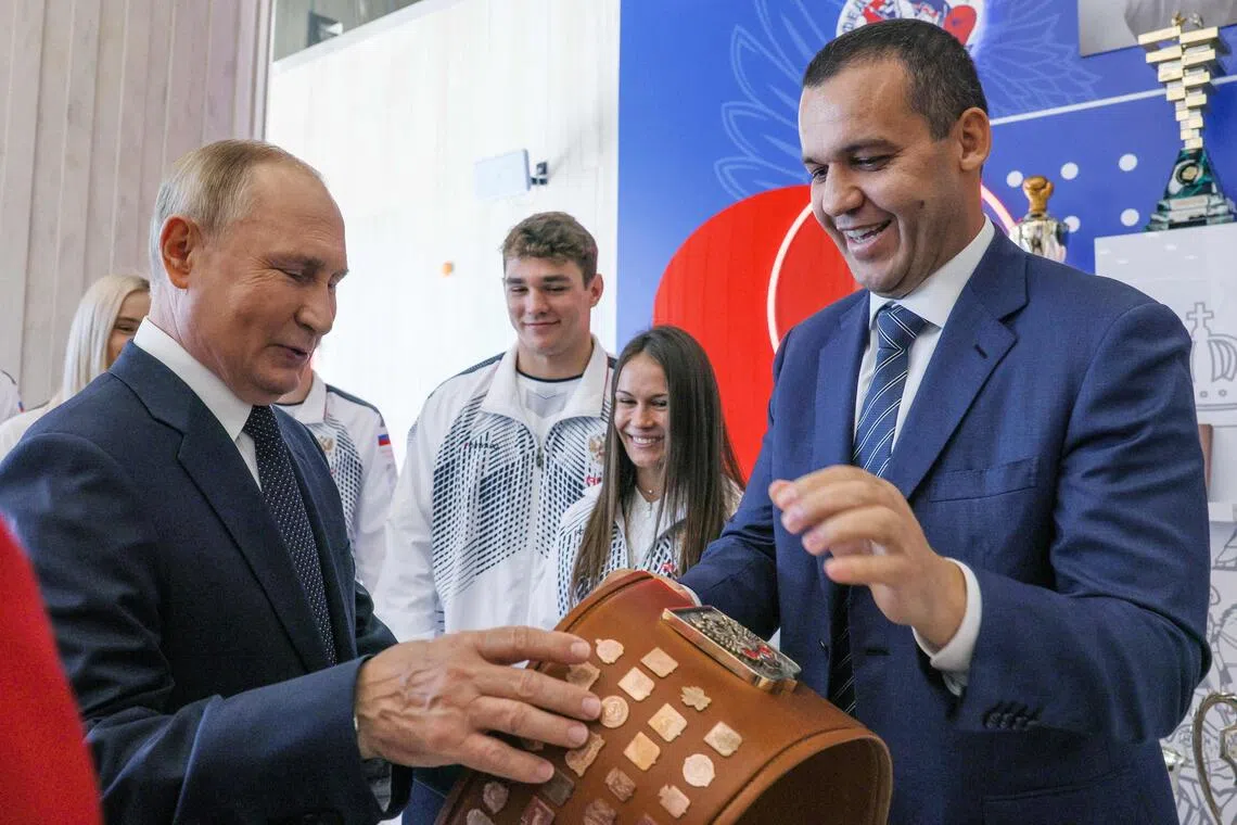 Russia’s President Vladimir Putin (left) and International Boxing Assosiation president Umar Kremlev are seen touring a newly opened boxing facility in Moscow on Sept 10, 2022.