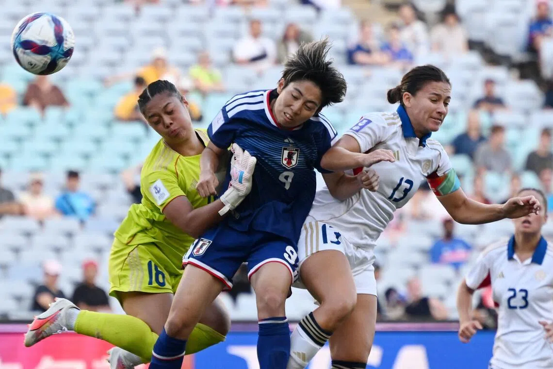 Japan’s Riko Ueki directs a header off the goalpost under pressure from the Philippines’ Angela Beard and goalkeeper Nina Meollo in their AFC Women's Asian Cup football quarter-final at Accor Stadium in Sydney on March 15, 2026.