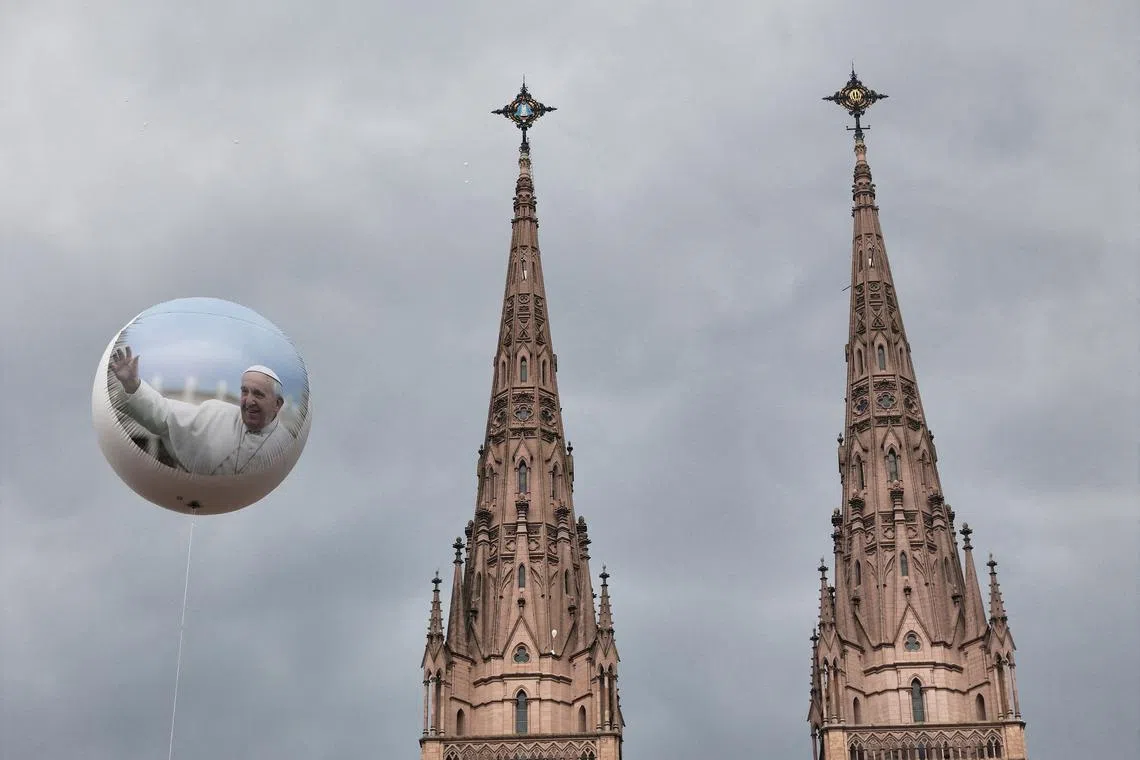 A balloon with the image of Pope Francis and the Lujan basilica during a Mass for the recovery of Pope Francis' health, in Buenos Aires, Argentina, Mar 16, 2025. 