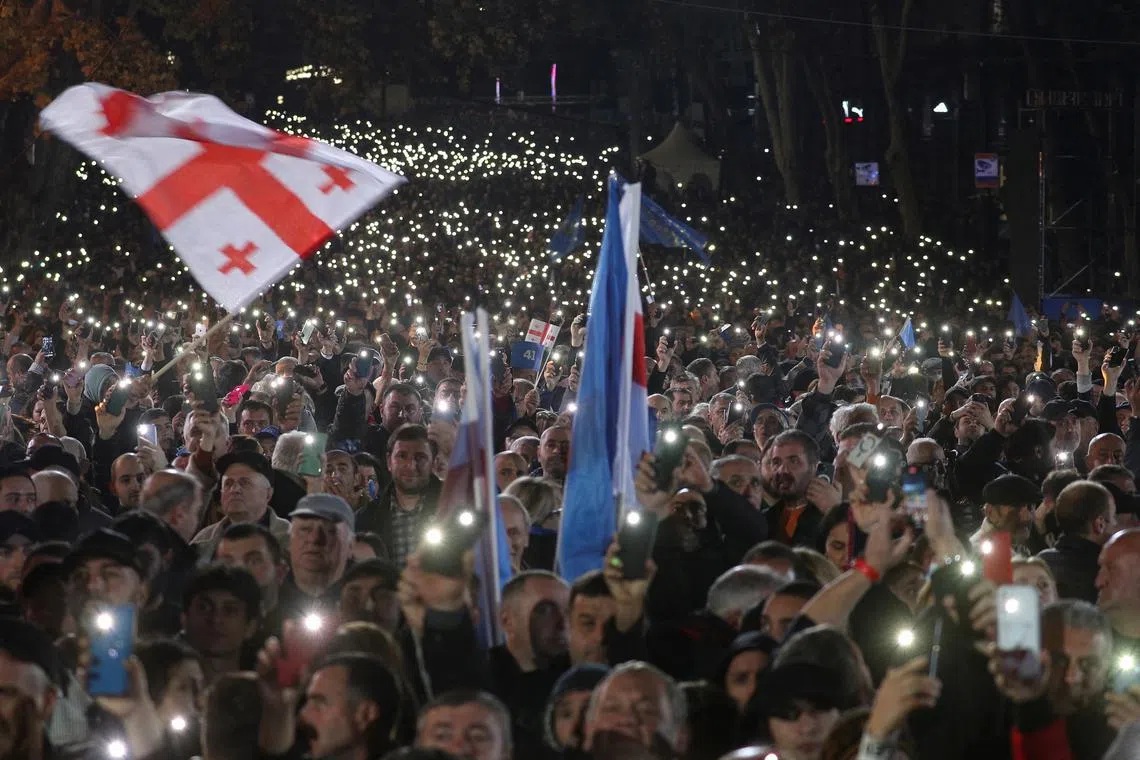 Supporters of the Georgian Dream party attend a final campaign rally ahead of the upcoming parliamentary elections in Tbilisi, Georgia October 23, 2024. REUTERS/Irakli Gedenidze/File Photo