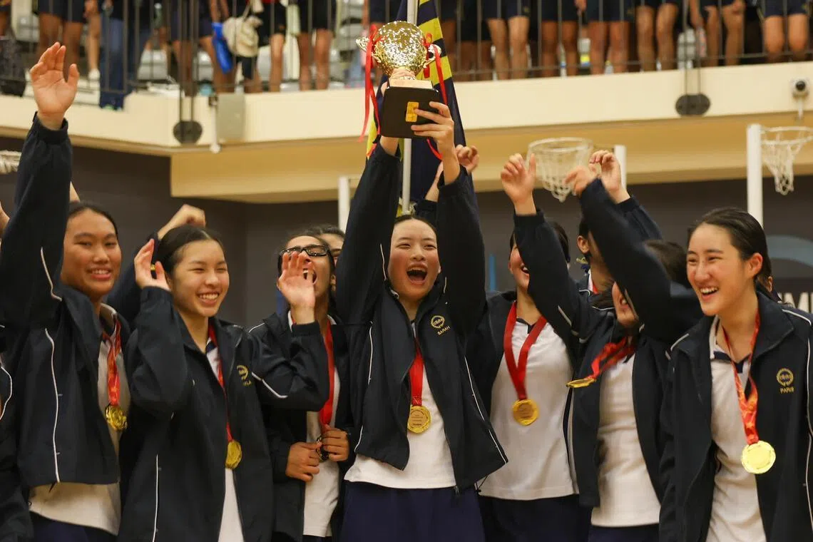 MGS Netball Captain Sarah Lim lifting the trophy after winning the National School Games B Division Girls netball finals held at Singapore Sports School on April 24, 2026.