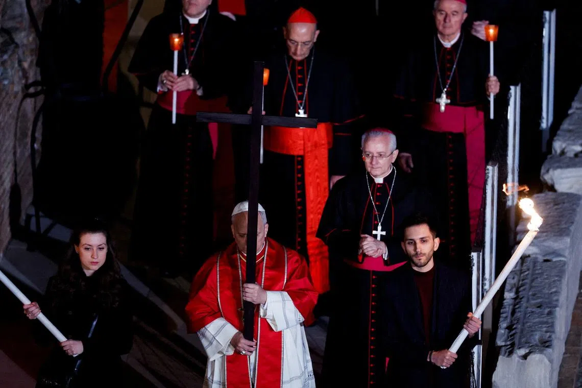 Pope Leo XIV presides over the Via Crucis (Way of the Cross) procession during Good Friday celebrations, at the Colosseum, in Rome, Italy, April 3, 2026. REUTERS/Remo Casilli