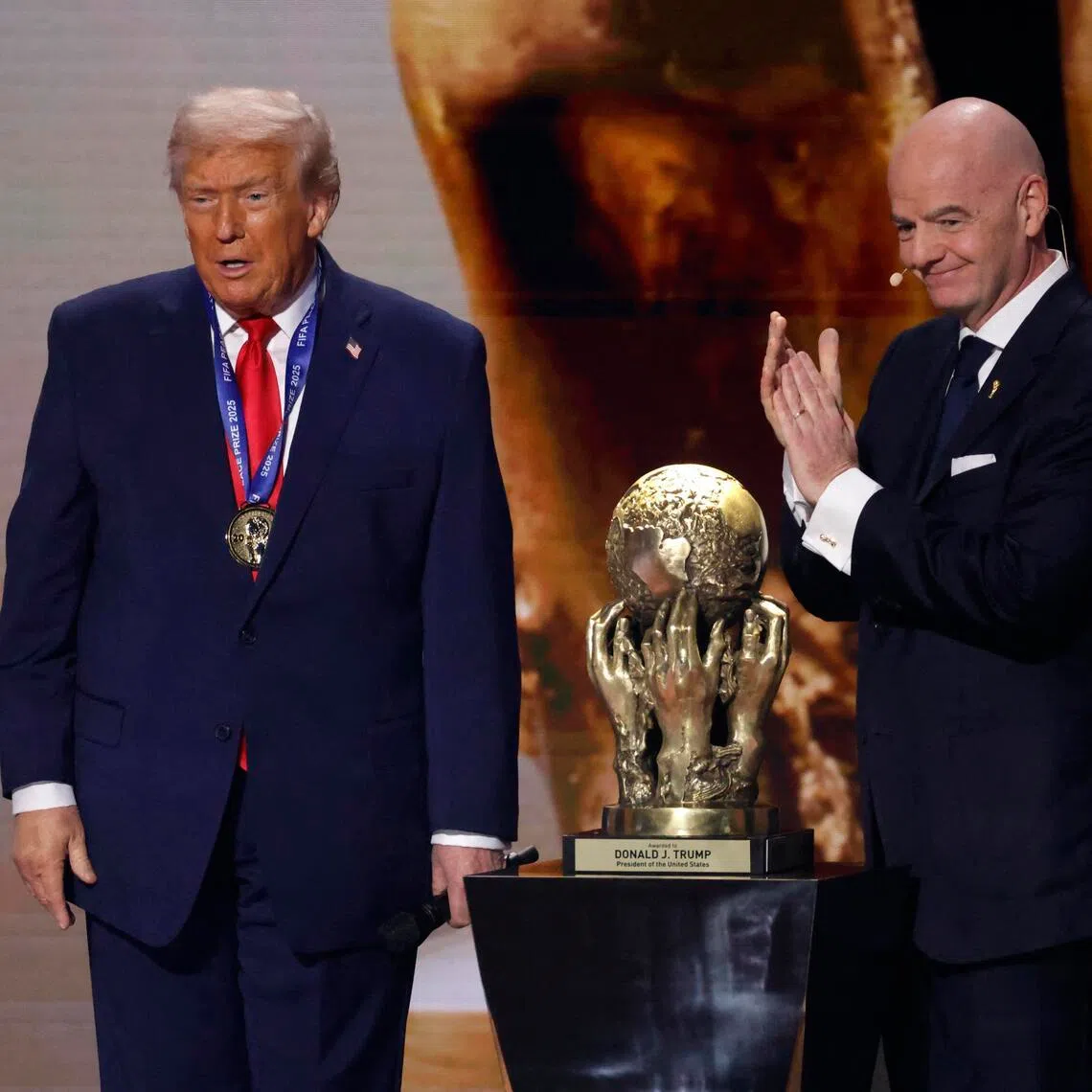 FIFA president Gianni Infantino (right) presenting US President Donald Trump with the FIFA Peace Prize, during the FIFA World Cup 2026 Final Draw in December 2025.