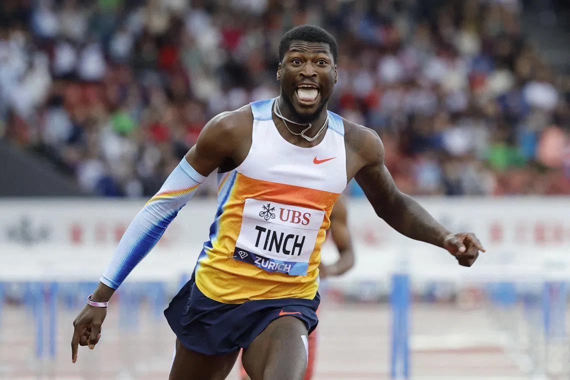 FILE PHOTO: Athletics - Diamond League - Final - Zurich - Letzigrund, Zurich, Switzerland - August 28, 2025 Cordell Tinch of the U.S. celebrates after winning the Men's 110m Hurdles Final REUTERS/Stefan Wermuth/File Photo