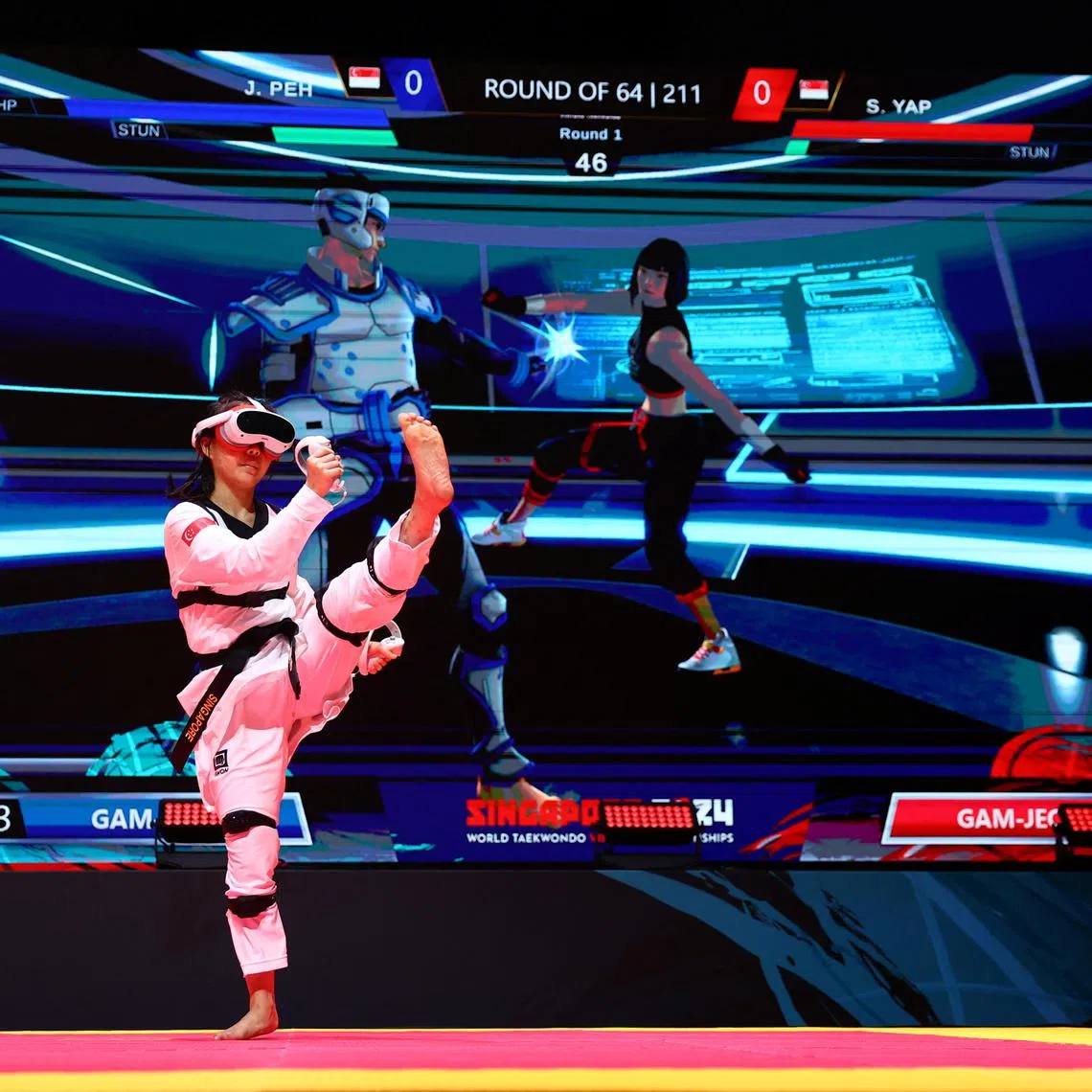 Singapore's Sherri Yap sparring against compatriot Justin Peh at the inaugural World Taekwondo Virtual Championships in Singapore.