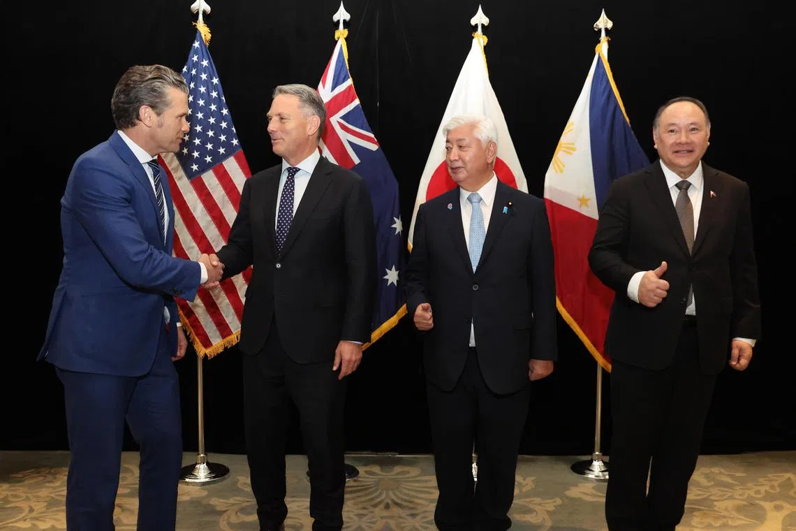 epa12146728 (L-R) US Defense Secretary Pete Hegseth, Australia’s Deputy Prime Minister and Minister for Defence Richard Marles, Japan’s Minister of Defense Nakatani Gen, and Philippines Secretary of National Defense Gilberto Teodoro Jr. shake hands with each other following their multilateral meeting on the sidelines of the International Institute for Strategic Studies (IISS) Shangri-La Dialogue Defence Summit in Singapore, 31 May 2025. Defense ministers and officials from 47 countries are gathered in the city-state for the IISS Shangri-La Dialogue, an annual high-level defense summit in the Asia-Pacific region.  EPA-EFE/HOW HWEE YOUNG