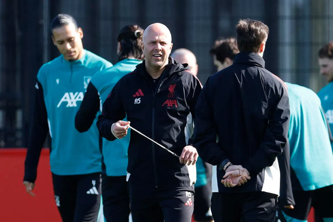 Soccer Football - UEFA Champions League - Liverpool Training - AXA Training Centre, Liverpool, Britain - March 17, 2026 Liverpool manager Arne Slot with players during training Action Images via Reuters/Jason Cairnduff