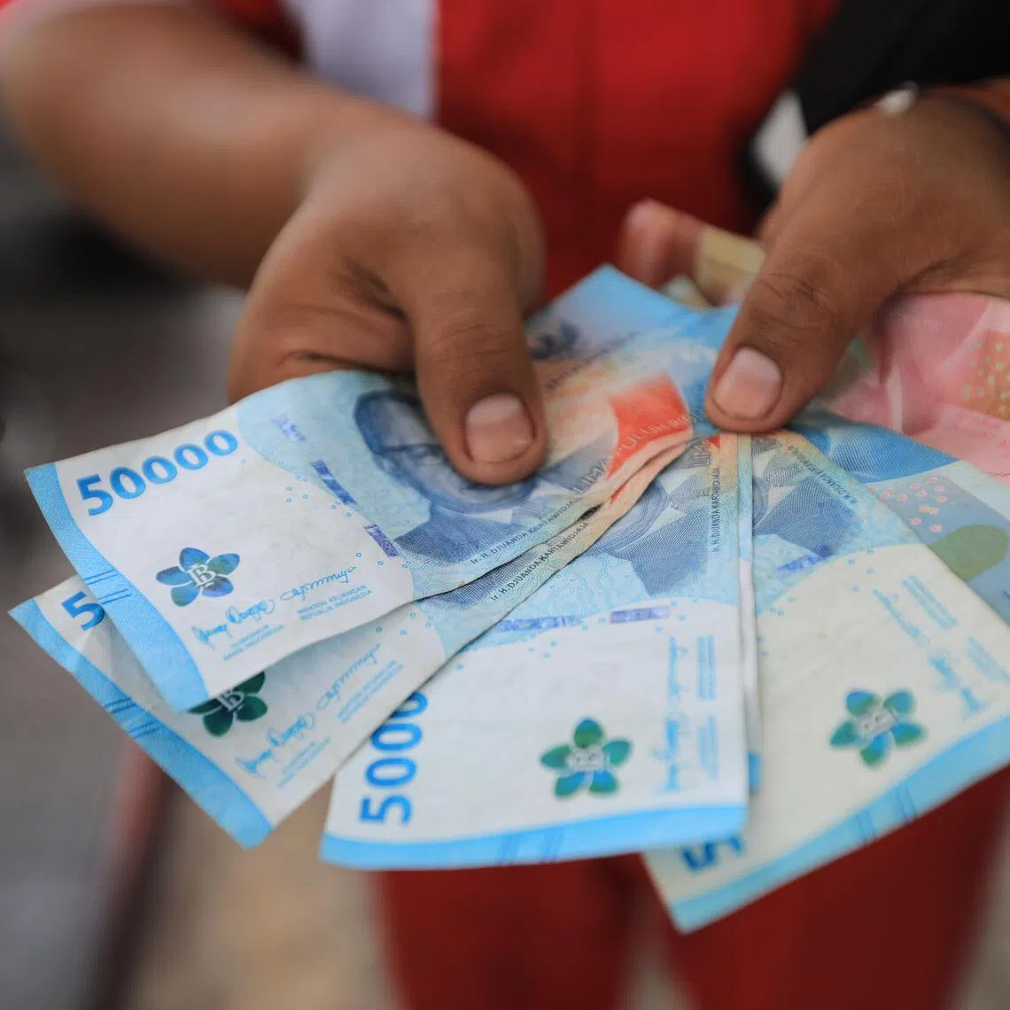 The rupiah's slump underscores investor concern that persistently high oil prices are straining the country’s finances.