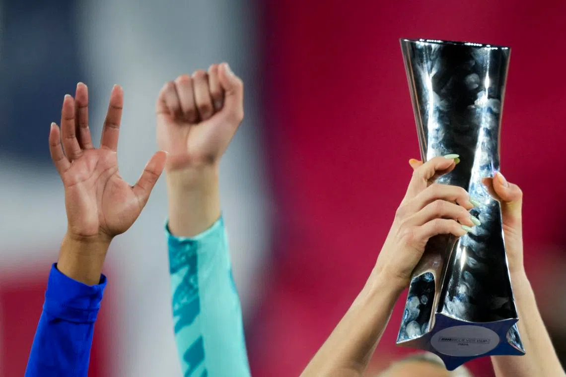 FILE PHOTO: Apr 9, 2024; Columbus, Ohio, USA;  United States players hold the trophy as they celebrate after defeating Canada in penalty kicks at Lower.com Field. Mandatory Credit: Aaron Doster-USA TODAY Sports/File Photo