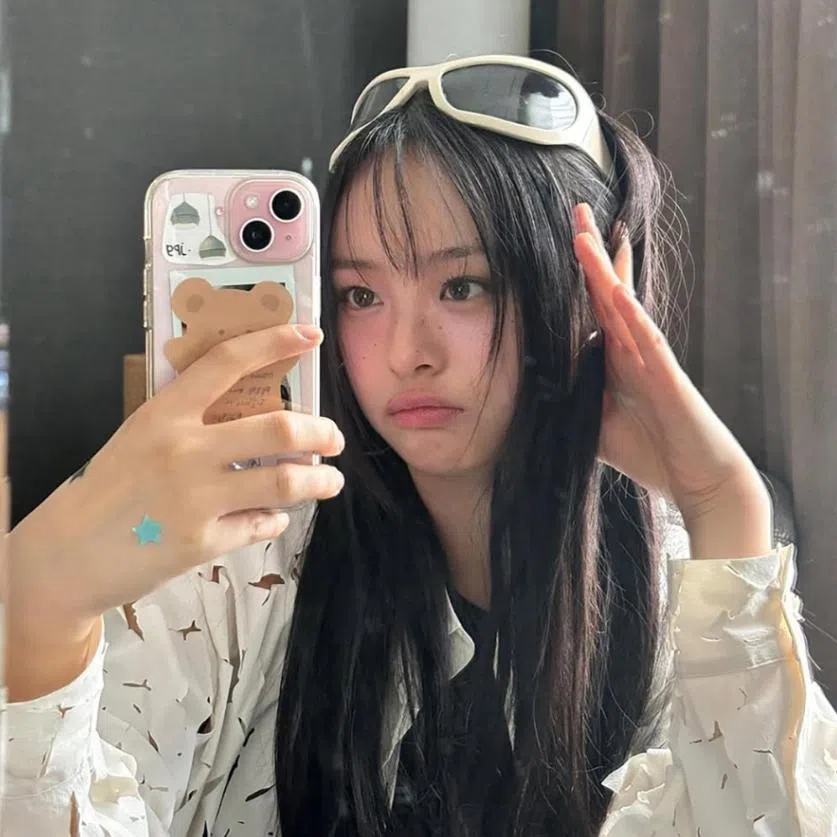 Ador confirmed on April 28 that (clockwise from left) Hyein, Hanni and Haerin recently travelled to Copenhagen for music production.