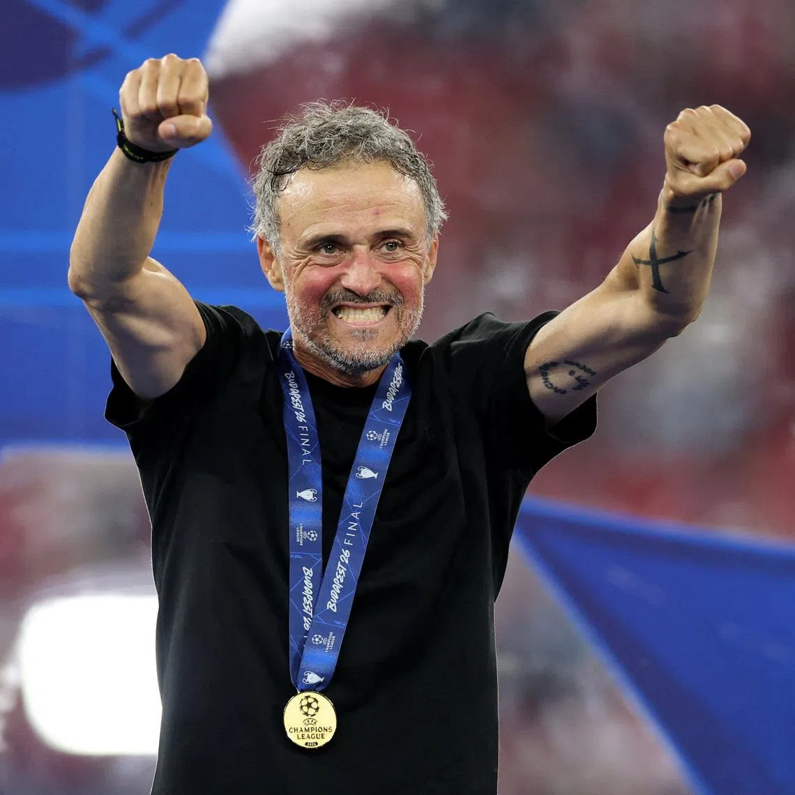 Paris Saint-Germain coach Luis Enrique celebrates after winning a second consecutive Champions League title.