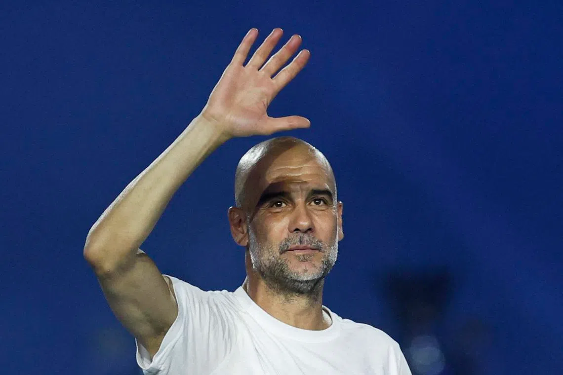 Soccer Football - Manchester City FA Cup and Carabao Cup Victory Parade - Manchester, Britain - May 25, 2026 Manchester City manager Pep Guardiola celebrates after the victory parade Action Images via Reuters/Jason Cairnduff