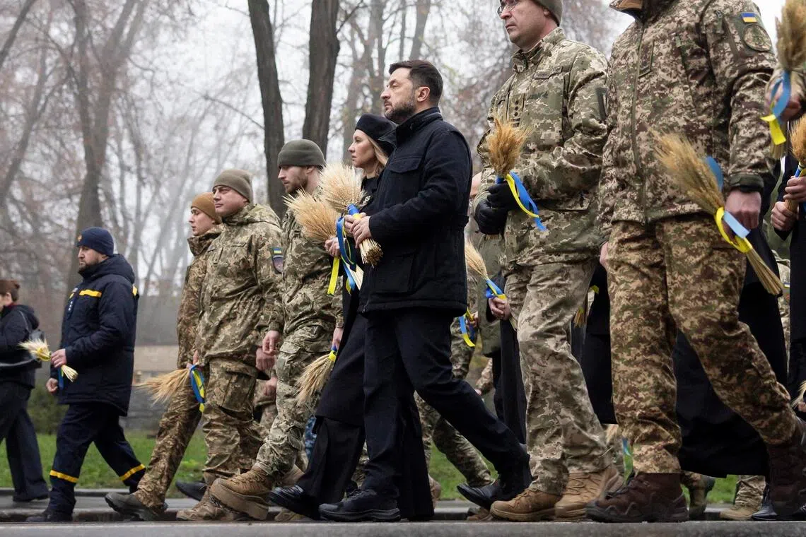 Ukrainian President Volodymyr Zelensky (centre) and Ukrainian First Lady Olena Zelenska commemorating the Holodomor genocide on Nov 22, when a Soviet-engineered famine between 1932 and 1933 claimed millions of Ukrainian lives.