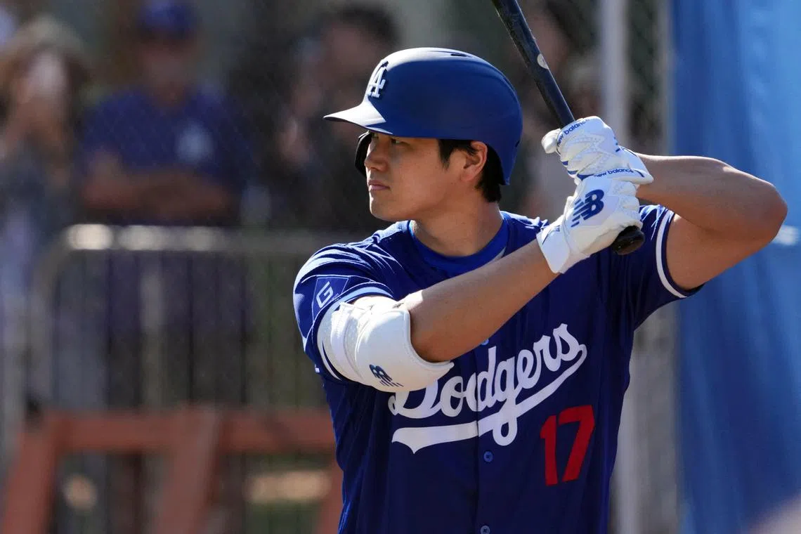 Los Angeles Dodgers designated hitter Shohei Ohtani standing in as a batter during pitcher drills during a Spring Training workout at Camelback Ranch.
