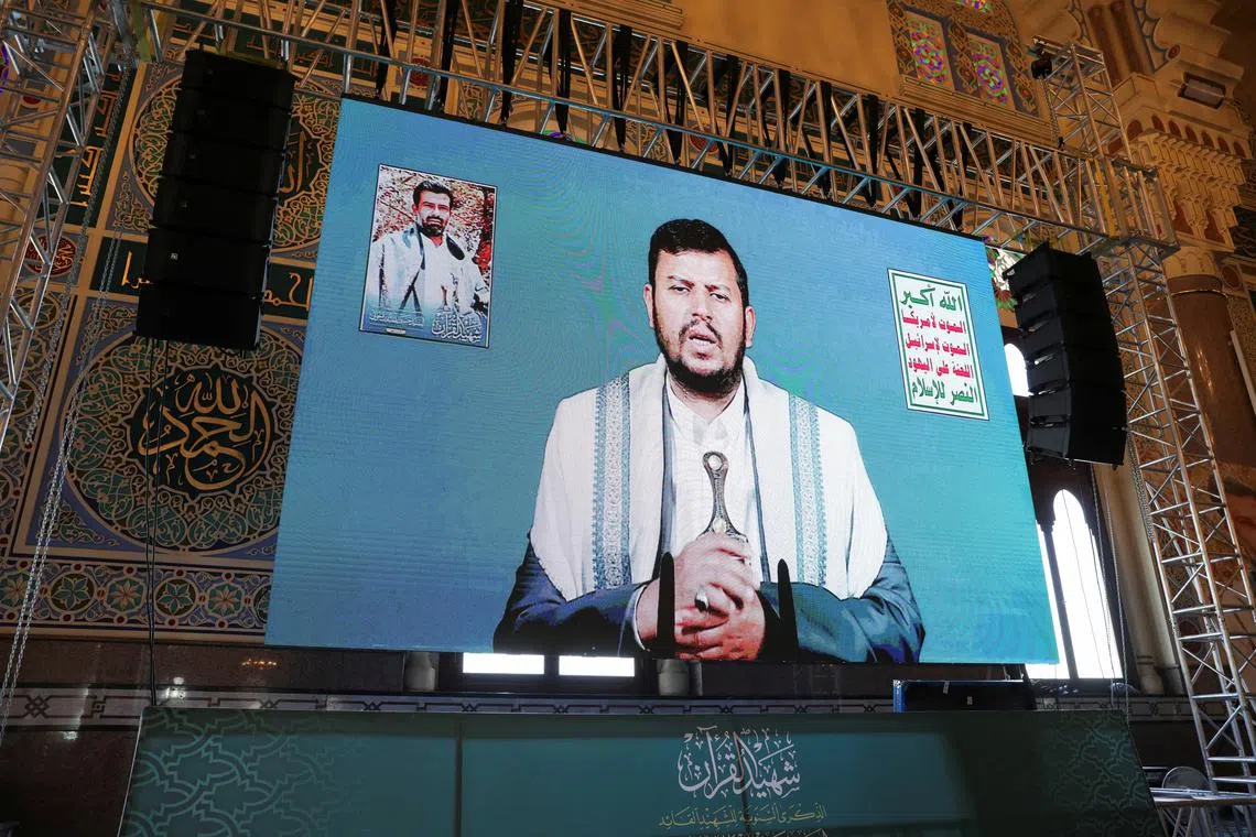 FILE PHOTO: Houthi leader Abdul-Malik al-Houthi addresses followers via a video link at the al-Shaab Mosque, formerly al-Saleh Mosque, in Sanaa, Yemen February 6, 2024. REUTERS/Khaled Abdullah/File Photo